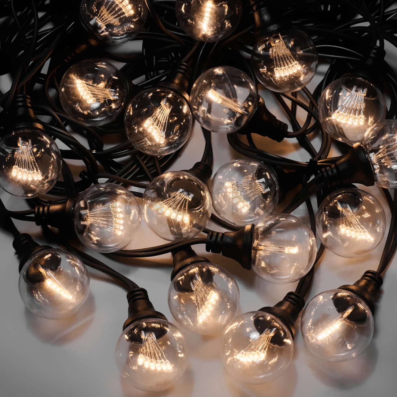 Гирлянда Стрит-Лофт INOXHUB 10м, 20 ламп, 220В, IP65, чёрная резина 3.3мм, ТЁПЛЫЙ БЕЛЫЙ фото Иноксхаб